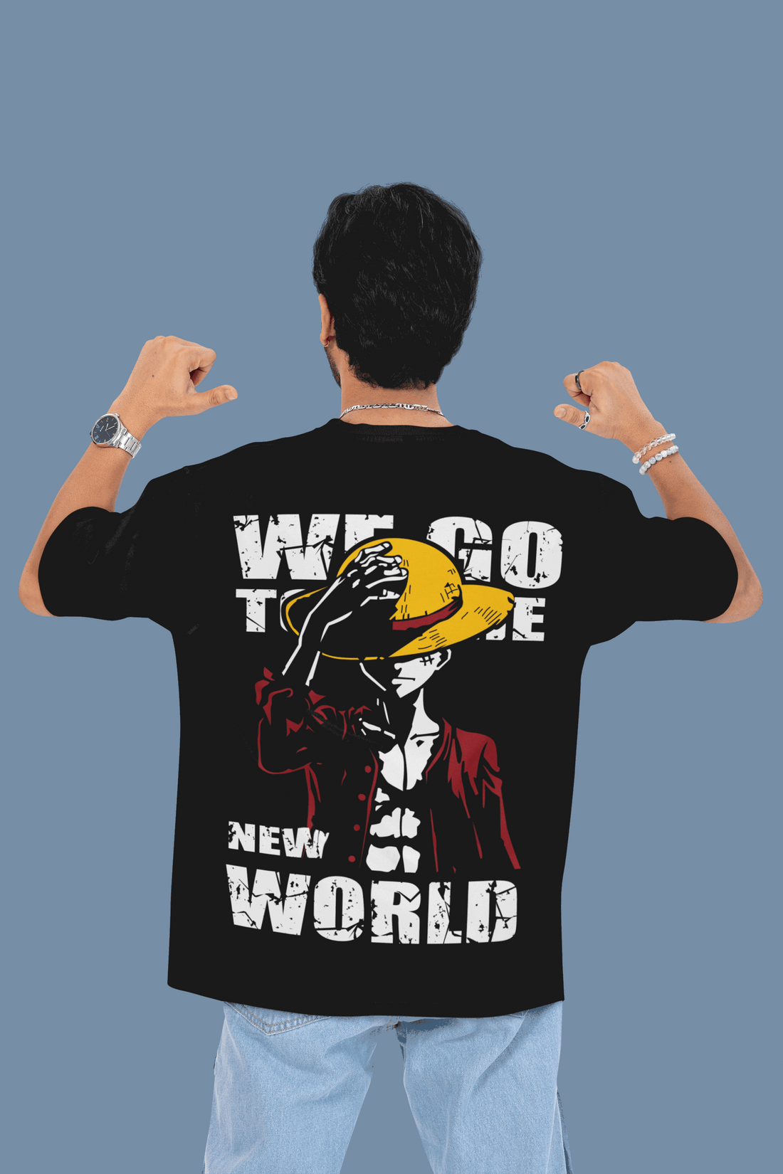 Person wearing a black t-shirt with a graphic design and text on the back, against a plain background.