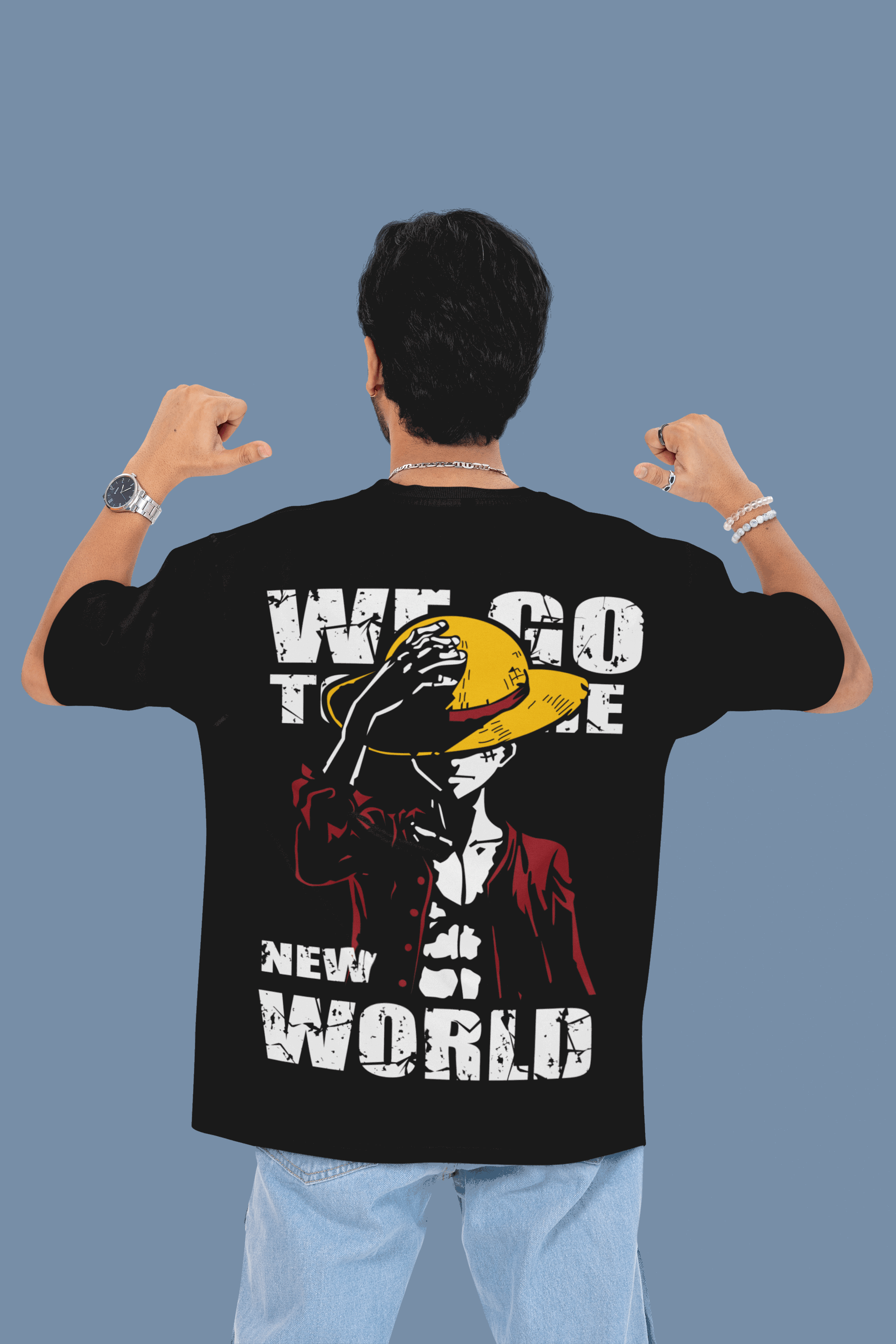 Person wearing a black t-shirt with a graphic design and text on the back, against a plain background.