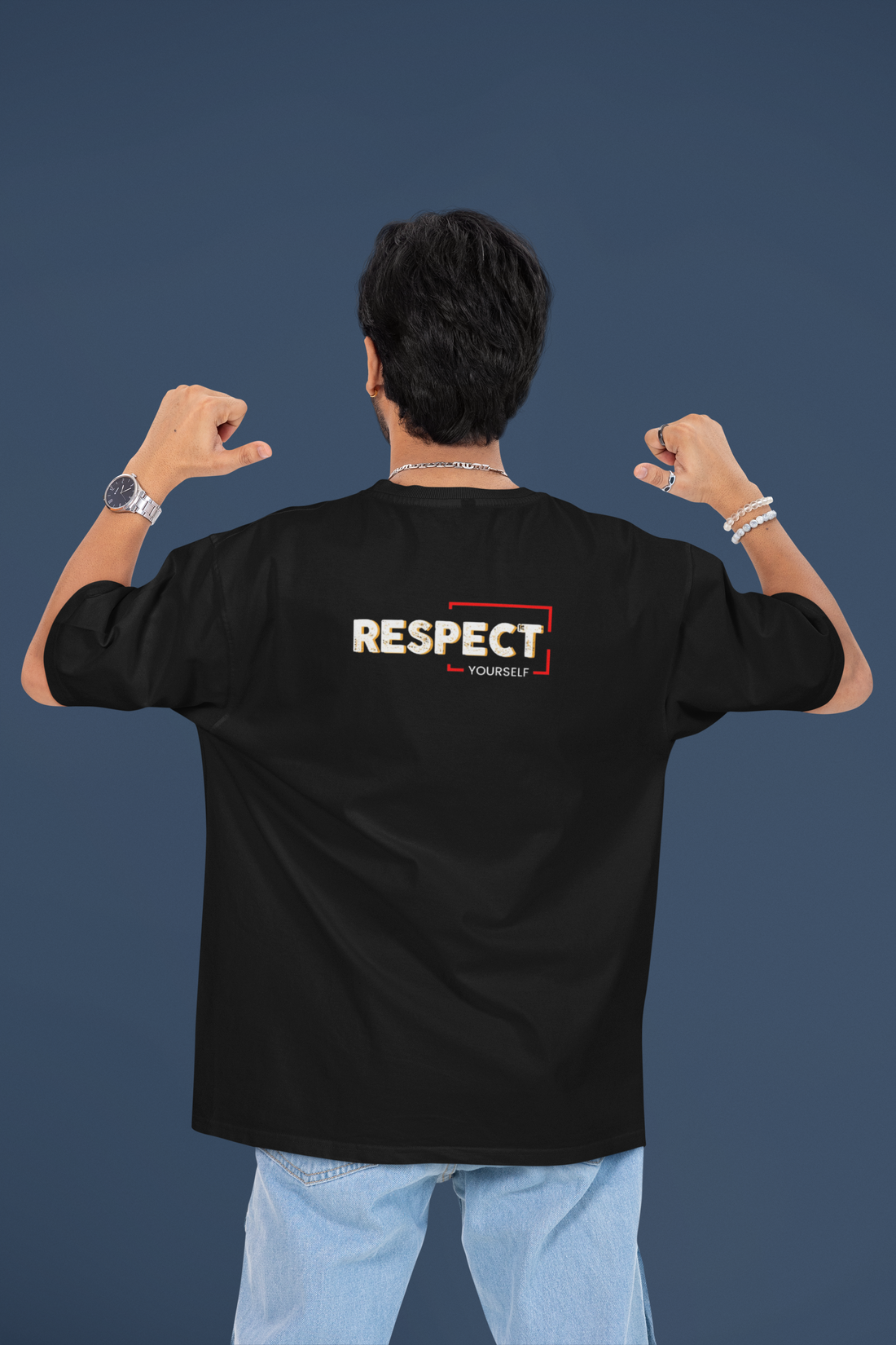 Person wearing a black t-shirt with 'RESPECT' printed on the back against a dark blue background